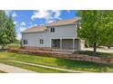 Beautiful backyard featuring a spacious wooden deck and a lush green lawn at 10570 Echo Ct, Firestone, CO 80504