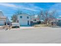 Charming two-story home with a spacious two-car garage and well kept yard at 9120 W Bellwood Pl, Littleton, CO 80123