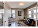 Office features hardwood flooring, bright windows, and flexible space for work or hobbies at 1902 Pioneer Cir, Lafayette, CO 80026