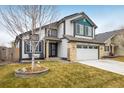 Beautiful two-story home with a lovely front yard and a two-car garage at 9094 W 103Rd Ave, Broomfield, CO 80021