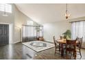 Bright living room showcasing hardwood floors, high ceilings, and natural light at 9094 W 103Rd Ave, Broomfield, CO 80021