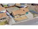 An aerial view of the home and neighborhood showing the yard and neighboring homes at 14441 Maxwell Pl, Denver, CO 80239