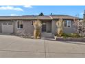 Charming single-story home with a well-maintained front yard and attached garage at 4750 E Louisiana Ave, Denver, CO 80246