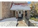 Condo building entrance with steps and a black metal railing at 14780 E Kentucky Dr # 414, Aurora, CO 80012