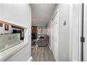 Hallway view of living room with fireplace and access to bedroom at 14780 E Kentucky Dr # 414, Aurora, CO 80012