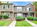 Inviting townhouse with well-manicured lawn and shrubbery, and classic siding at 9632 W Chatfield Ave # C, Littleton, CO 80128