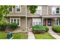 Well-maintained townhouse featuring neutral siding, neat landscaping, and a welcoming entrance at 9632 W Chatfield Ave # C, Littleton, CO 80128