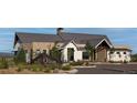 Beautiful stone and siding clubhouse with mountain views and well maintained landscaping at 332 Agoseris Way, Castle Rock, CO 80104