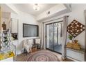Cozy dining area with a round rug, bench seating, and a sliding glass door to the balcony at 7250 Eastmoor Dr # 203, Denver, CO 80237