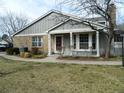 Inviting home featuring brick accents and a cozy front porch with ample natural light at 3011 W Long Ct # F, Littleton, CO 80120