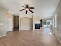 Bright living room featuring hardwood floors and fireplace at 2258 Whistler Dr, Longmont, CO 80504