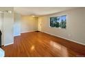 Living room with hardwood floors and access to the hallway at 750 Tabor St # 18, Lakewood, CO 80401