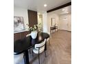 Stylish dining room featuring modern decor, hardwood floors, and lots of natural light at 1455 Hudson St, Denver, CO 80220