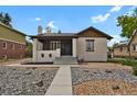 Charming single-Gathering home featuring a well-kept front yard and inviting entrance at 1455 Hudson St, Denver, CO 80220