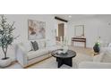 Cozy living room with stylish decor, comfortable seating, and bright, neutral tones at 1455 Hudson St, Denver, CO 80220