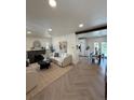 Bright living space with fireplace, modern decor, and open access to dining area at 1455 Hudson St, Denver, CO 80220