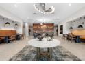 Elegant lobby with modern lighting, decorative wood paneling, stylish seating areas, and unique decor accents at 20 Wilcox St # 318, Castle Rock, CO 80104