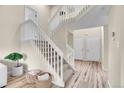 Staircase leading to upper level with neutral carpet and white railings at 2140 W 135Th Ave, Westminster, CO 80234