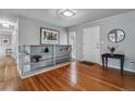 Bright entryway featuring hardwood floors, a built-in shelf, and stylish decor at 2041 W Briarwood Ave, Littleton, CO 80120