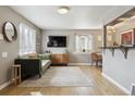 Stylish living room with hardwood floors, a modern sofa, and large windows for natural light at 373 S Locust St, Denver, CO 80224