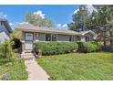 Inviting single-story home with tidy landscaping, showcasing a cozy and well-cared-for exterior at 200 Perry St, Denver, CO 80219