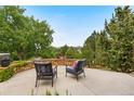 Outdoor patio with comfortable seating and serene views of the lush landscape at 276 Ember Pl, Castle Rock, CO 80104