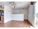 This living room offers wood floors, a ceiling fan and easy access to the outdoor deck at 3351 S Field St # 164, Lakewood, CO 80227