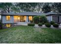 Well-maintained home on a lush lawn with mature landscaping creates an inviting curb appeal at 2635 S Lamar Way, Lakewood, CO 80227