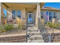 Close-up of a welcoming front porch with stone pillars and decorative details at 149 Jewel St, Brighton, CO 80603