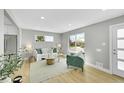Bright living room with hardwood floors, natural light, and stylish decor at 7634 Navajo St, Denver, CO 80221
