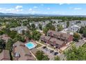 An aerial view of the community and pool, showcasing the surrounding neighborhood with mountain views at 311 W Lehow Ave # 3, Englewood, CO 80110