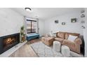 This well-lit living room showcases a fireplace, stylish seating, and inviting decor at 311 W Lehow Ave # 3, Englewood, CO 80110