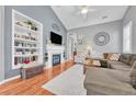 Cozy living room with vaulted ceilings, fireplace, built-in shelving and hardwood floors at 19771 E Wesley Pl, Aurora, CO 80013