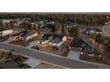 An aerial view of a home in a beautiful neighborhood surrounded by lush greenery and mature trees at 6001 Powell Rd, Parker, CO 80134