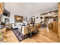 Spacious living room with hardwood floors, comfortable seating, and stylish decor at 4845 S Taft St, Morrison, CO 80465