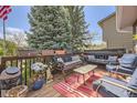 Inviting outdoor deck area with comfortable seating, perfect for relaxing and entertaining guests at 4845 S Taft St, Morrison, CO 80465