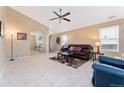 Inviting living room with plush seating, neutral carpet, and a cozy atmosphere at 464 N Jamestown Way, Aurora, CO 80018