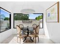 Cozy dining room featuring bright windows and a modern light fixture at 210 N Garfield St, Denver, CO 80206