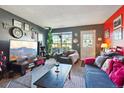 Inviting living room with stylish decor, a large window, and comfortable furniture at 2991 W 81St Ave # G, Westminster, CO 80031