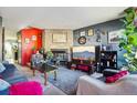 Cozy living room featuring a stone fireplace, plush seating, and colorful decor at 2991 W 81St Ave # G, Westminster, CO 80031