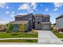 Inviting two-story home with beautiful stone accents and manicured landscaping at 8299 S Kellerman, Aurora, CO 80016