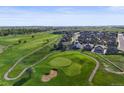 Beautiful aerial view of a golf course community and neighborhood at 1743 Homestead Dr, Fort Lupton, CO 80621