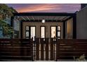 Charming front entrance with pergola, modern lighting, and secure gated access at 3618 Navajo St, Denver, CO 80211