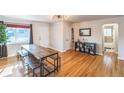 Bright living area showcasing hardwood floors, dining area, and natural light at 3241 Sheridan Blvd, Wheat Ridge, CO 80212