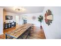 Spacious room featuring hardwood floors and decorative accents at 3241 Sheridan Blvd, Wheat Ridge, CO 80212
