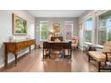 Charming home office with hardwood floors, natural light, and antique furniture for a classic look at 1920 Pioneer Cir, Lafayette, CO 80026