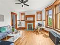 Inviting living room features a decorative fireplace, hardwood floors, and comfortable seating at 2124 E 17Th Ave # 4, Denver, CO 80206