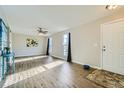 Spacious living room featuring hardwood floors and neutral wall colors at 11058 Grange Creek Dr, Thornton, CO 80233