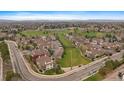 Expansive aerial view of residential area and surrounding green spaces, ideal for community living at 8615 W Berry Ave # 204, Littleton, CO 80123