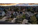 Gorgeous aerial shot of the neighborhood showcasing rooftops, solar panels, landscaping, and inviting street appeal at 25245 E Park Crescent Dr, Aurora, CO 80016